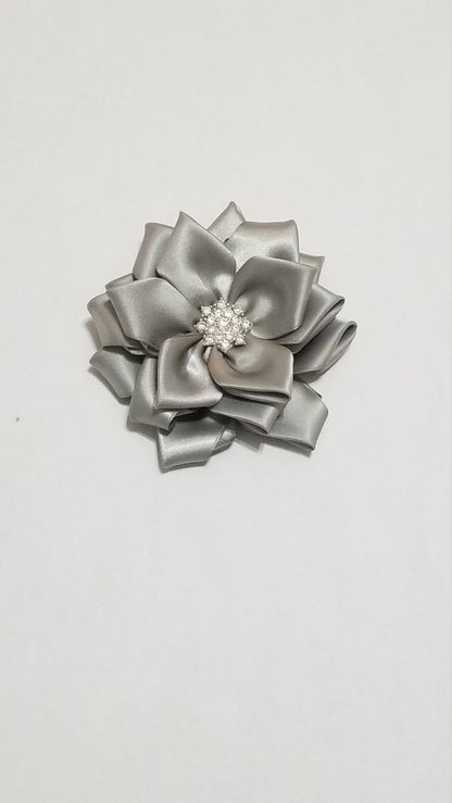 Silver anniversary corsage with detachable tail